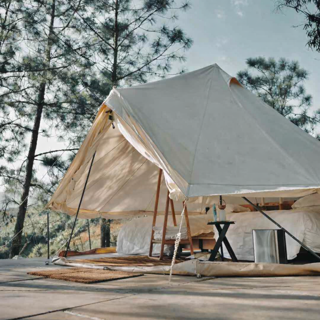 Luxury glamping tent at Nordisk Village Yunnan featuring comfortable interior design in a natural setting.